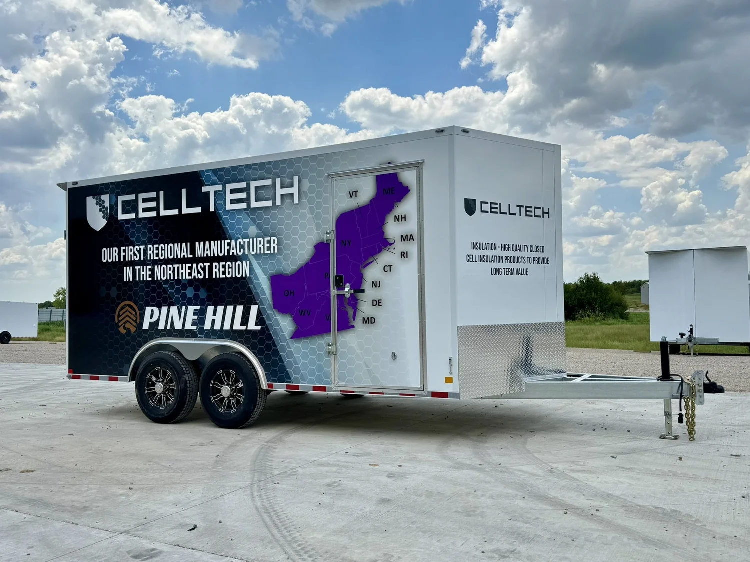An enclosed CellTech trailer with custom printed graphics